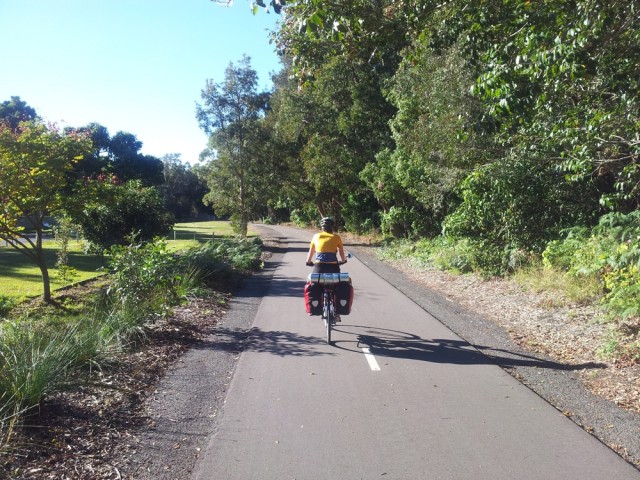 Jen on the Fernleigh Track.  Looks like a mini road only for cyclists and pedestrians. 